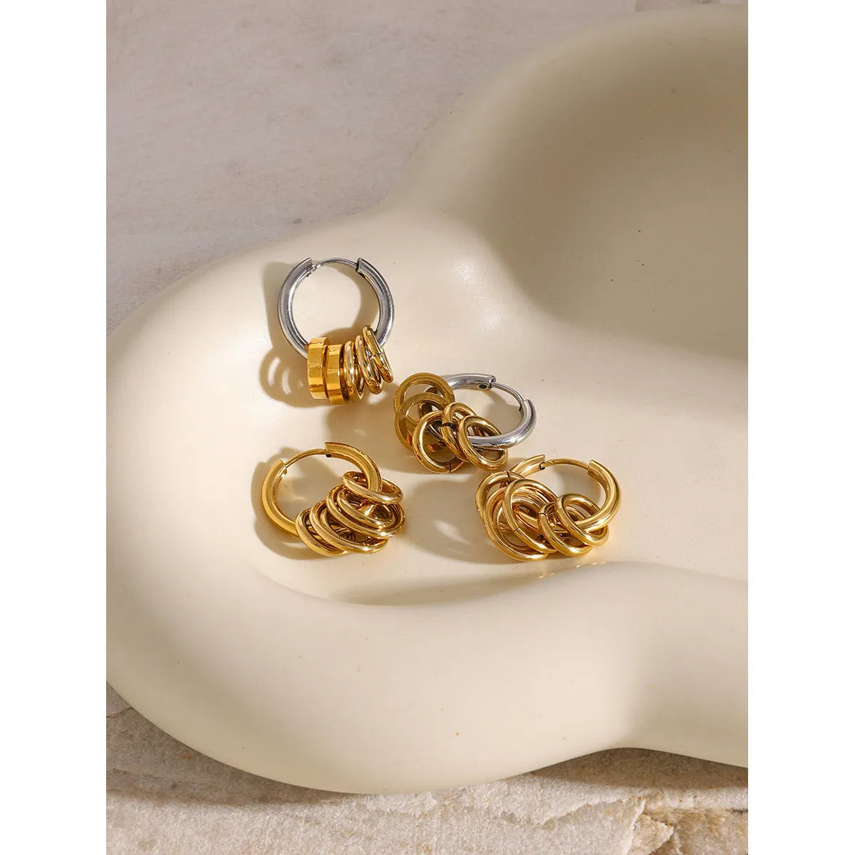 Pair of stainless steel ins style earrings with an electroplated finish in colour option JDE2405019.