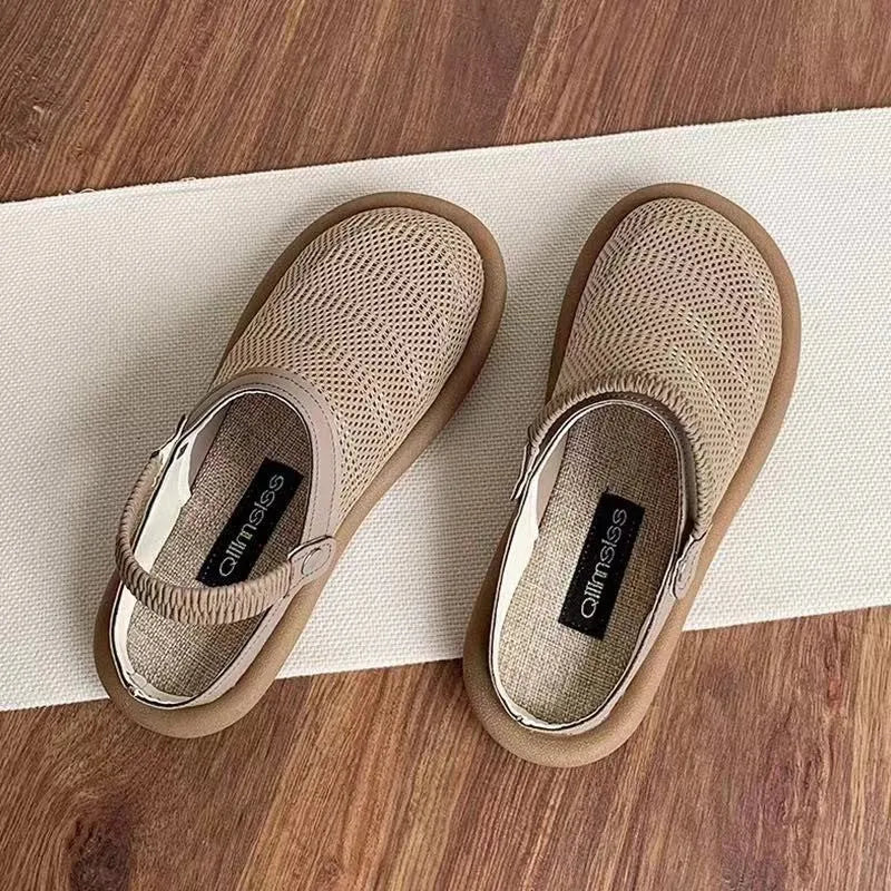 Breathable linen and mesh slip-on shoe with a soft rubber sole in milky white colour.