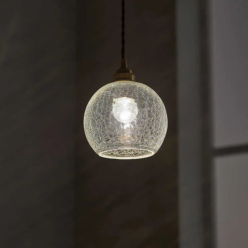 Brass and glass ball chandelier with copper body and clear spherical shade, shown in diamond colour.