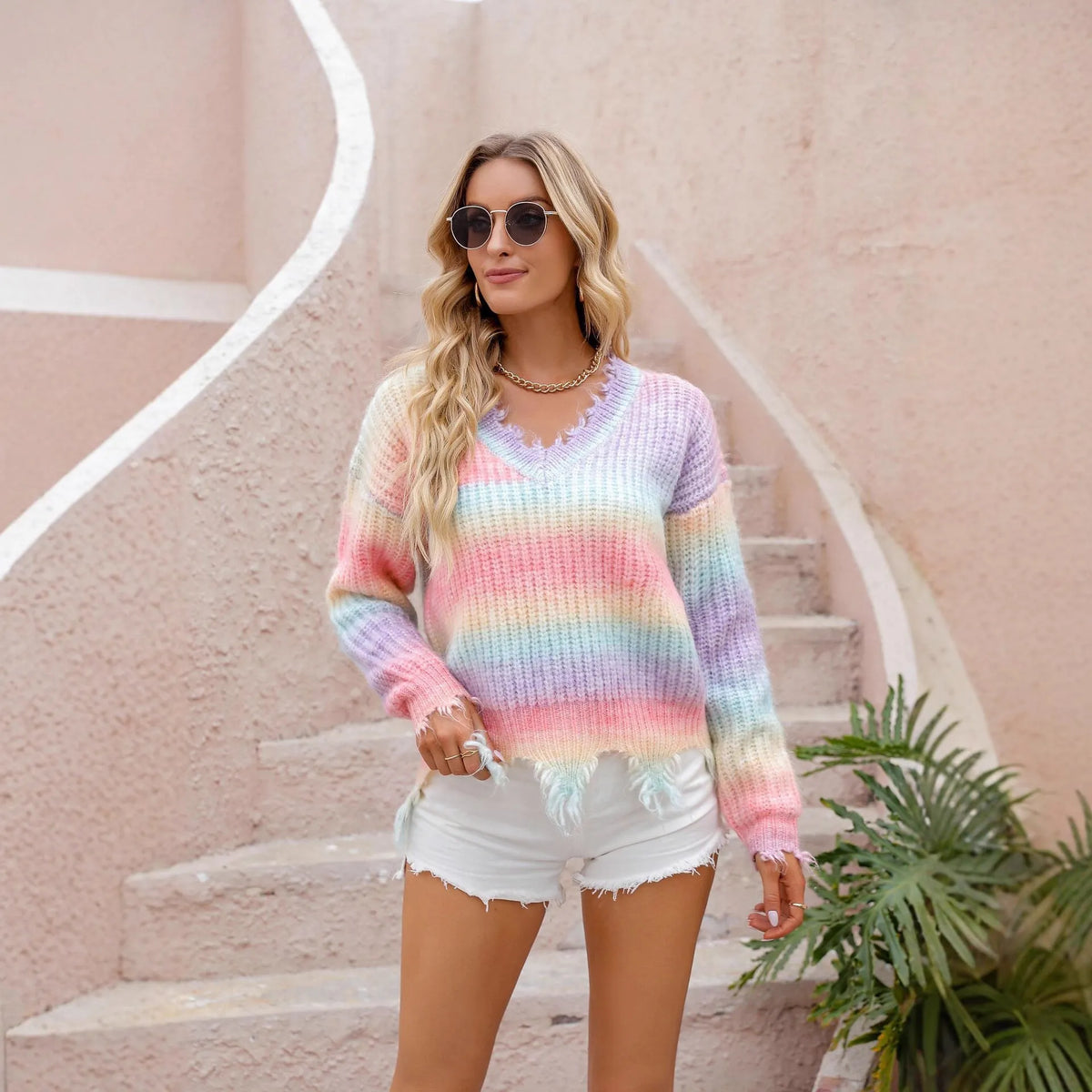 Pink loose cut knitted pullover sweater with rainbow gradient pattern and tassel detail, sizes S to XL