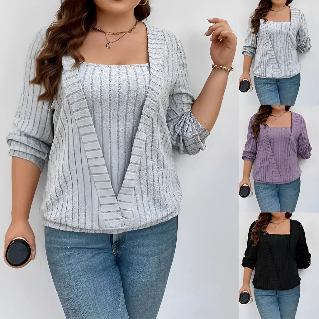 Solid colour rib fabric V-neck long sleeve top with a false two-piece suit design on a hanger.