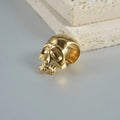 Stainless steel hollow geometric skull and Buddha head earrings in four colour options.