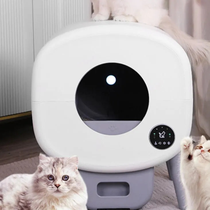 Automatic self-cleaning white cat litter box with large interior and sealed waste drawer compartment.