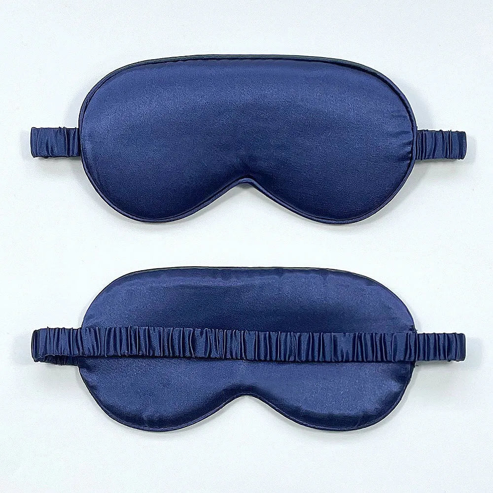 Rayon satin double-sided sleep mask in a selection of solid colours on a white background.