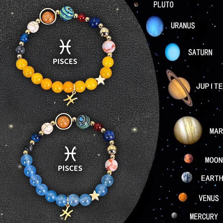 Two natural stone beaded bracelets with zodiac charms on a table, showing adjustable elastic cord.