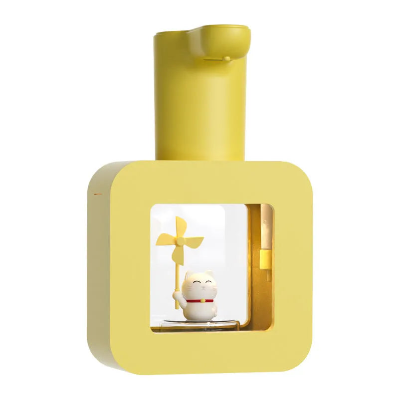 Pink automatic soap dispenser with cartoon unicorn and kitten design for kids bathroom.