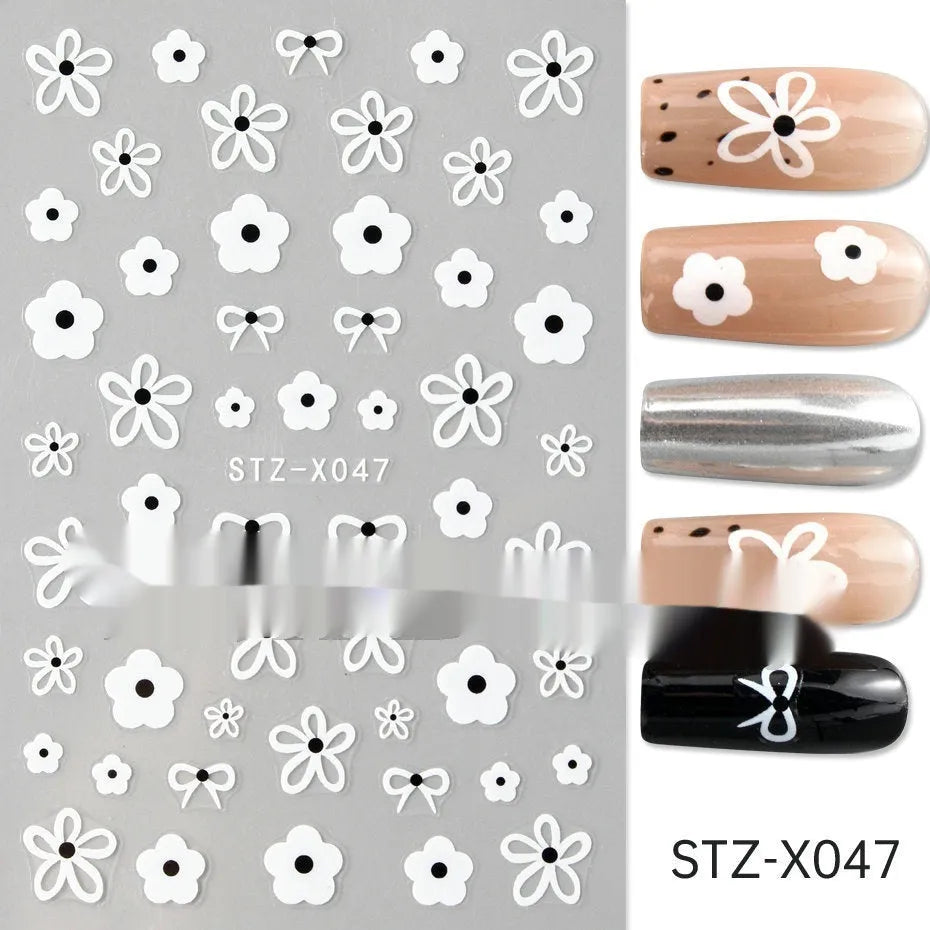 Cartoon-themed nail art sticker sheet with black and silver strip patterns and love motifs