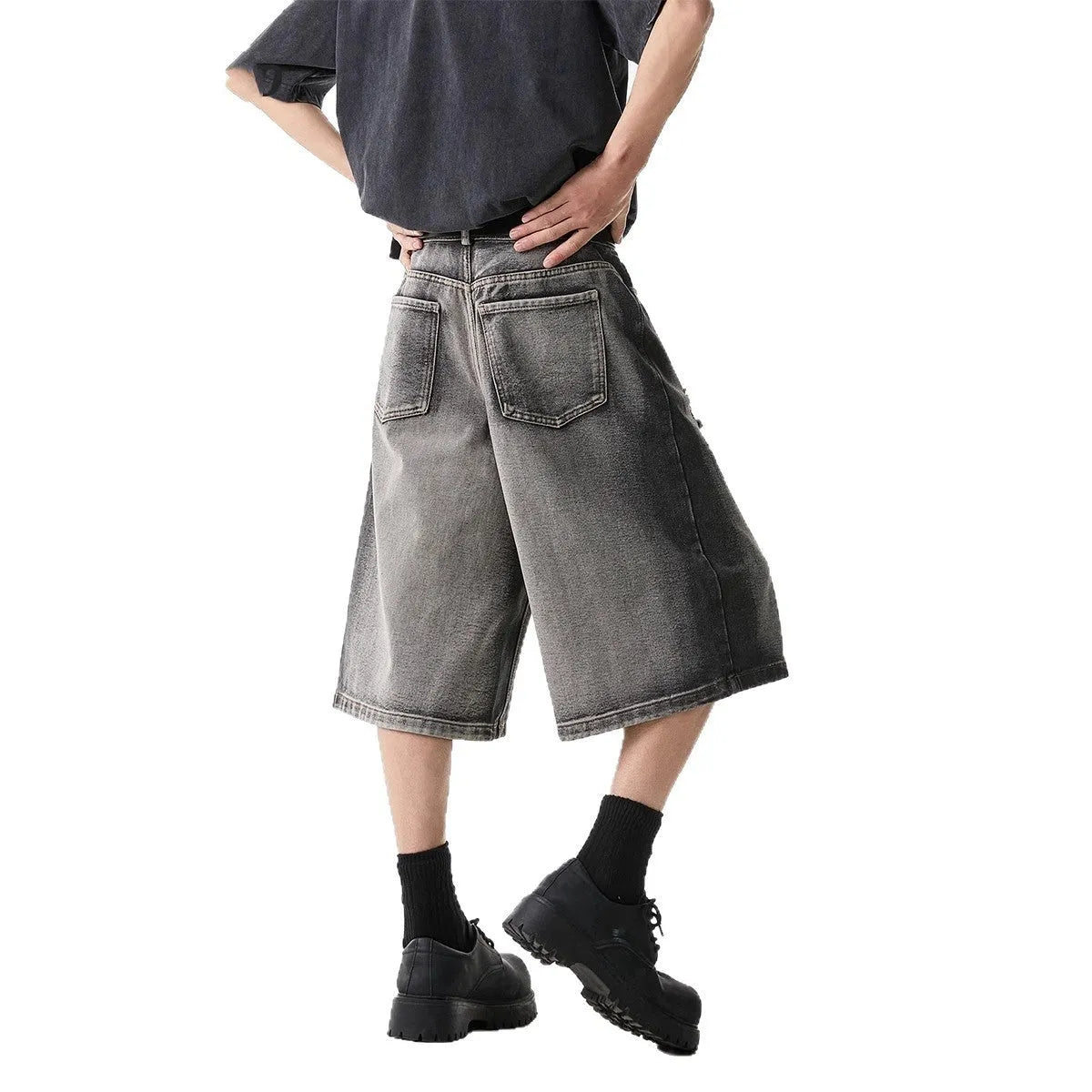 Grey water washed denim shorts with hole detailing and loose retro fit