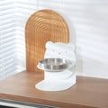 Inclined stainless steel cat feeding bowl on black magnetic stand with bear design