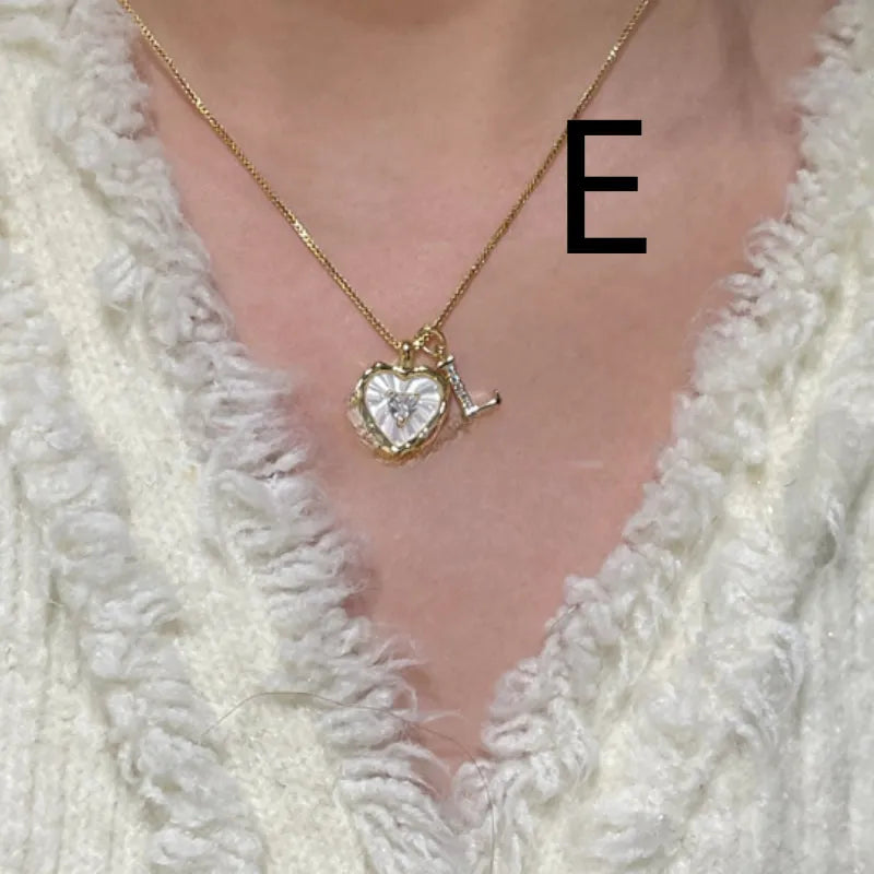Women's pendant necklace with titanium steel chain and natural mother-of-pearl in heart-shaped design
