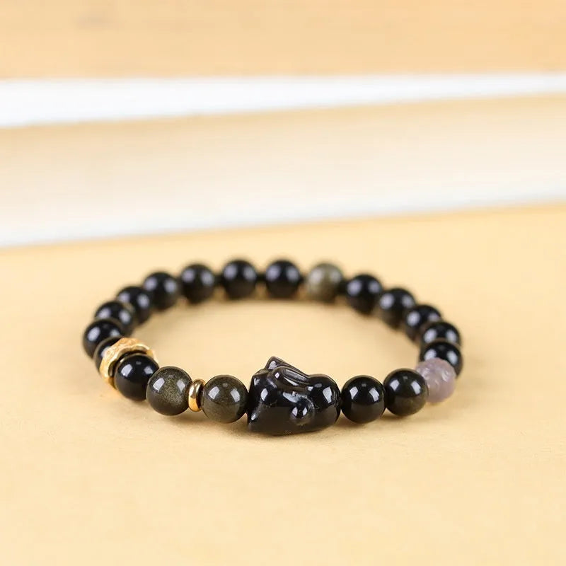 Handmade Chinese national style obsidian bracelet with lying rabbit charm and mixed metal and agate beads.