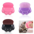 Three pet paw balm brushes with paw-shaped handles in individual storage boxes