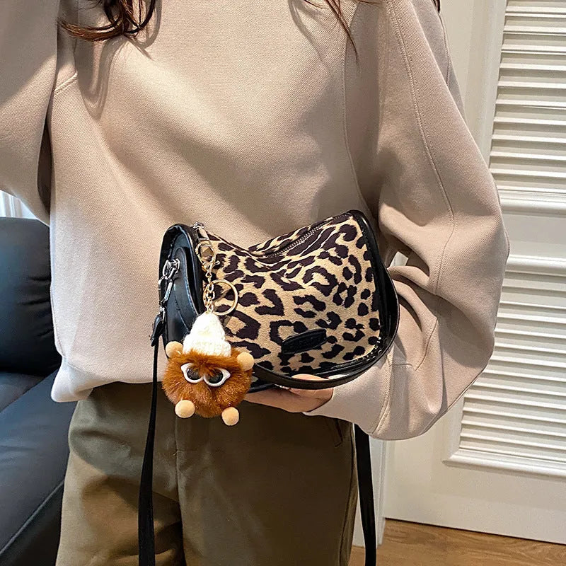 Fashion textured PU messenger bag for women in leopard print with cross-body strap and pendant