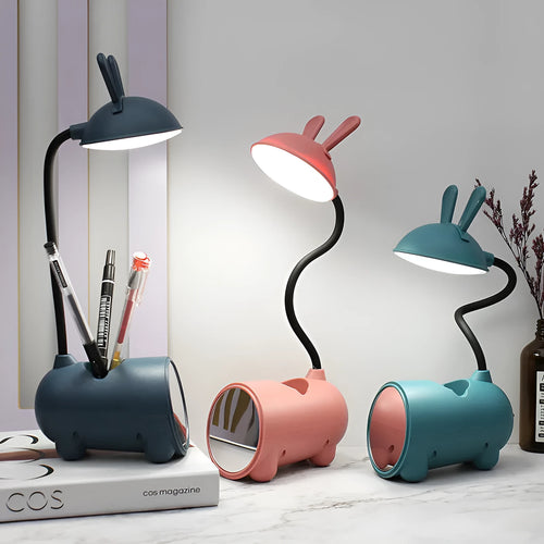 Cartoon-themed desktop table lamp with integrated pen container in green colour
