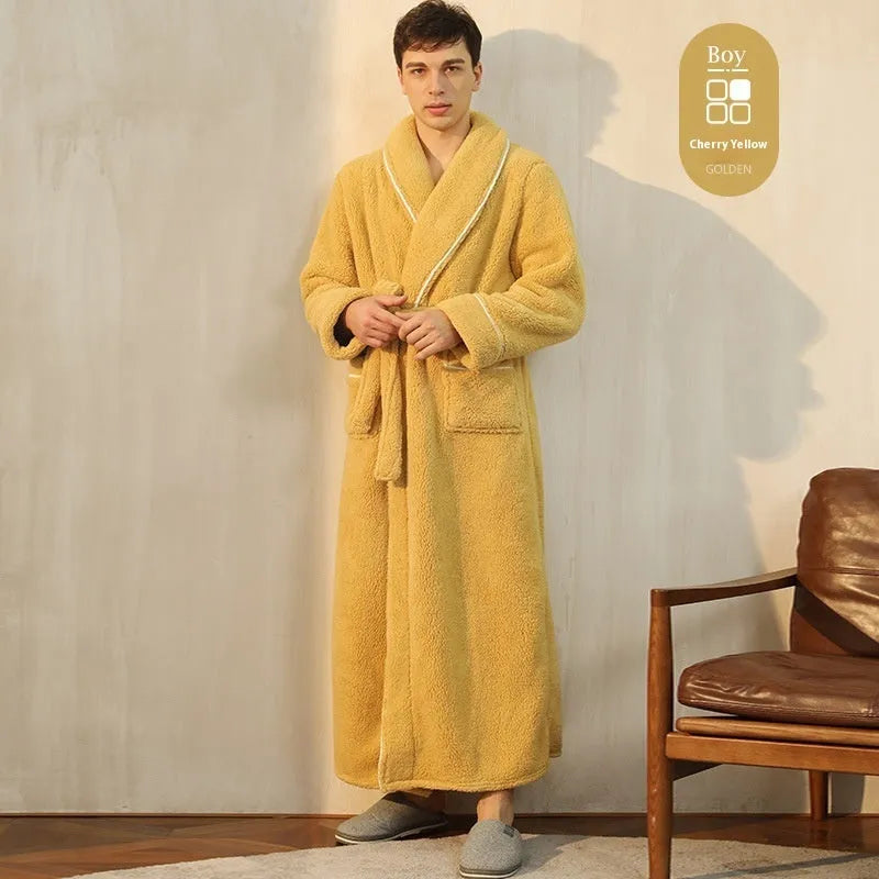 A man and woman wearing matching navy blue thick flannel bathrobes, showcasing the wrap-around design and plush fabric.
