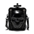 Black vertical square crossbody bag with embossed skull design, chain strap, and metal rivets.