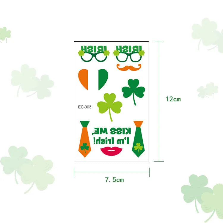 A single sheet of tattoo sticker paper featuring a green cartoon clover design for St. Patrick's Day, showing the water-transfer backing.