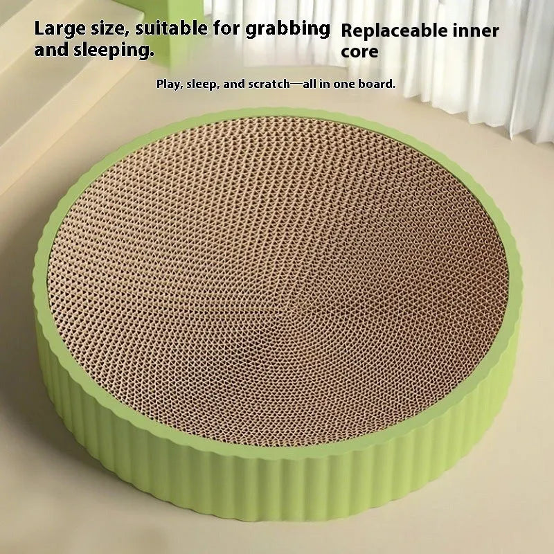 Green and white round cat scratching board measuring 55 cm with two spare corrugated paper refills