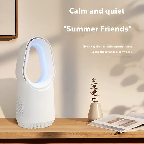 White bladeless tower fan with remote control on a wooden floor next to a desk.