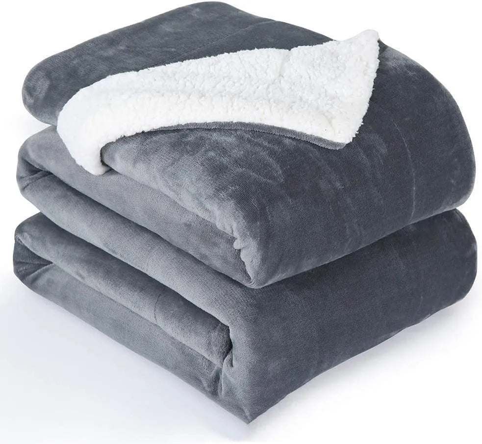 Grey, brown and white USB electric heating blanket with intelligent temperature controls on soft flannel fabric.
