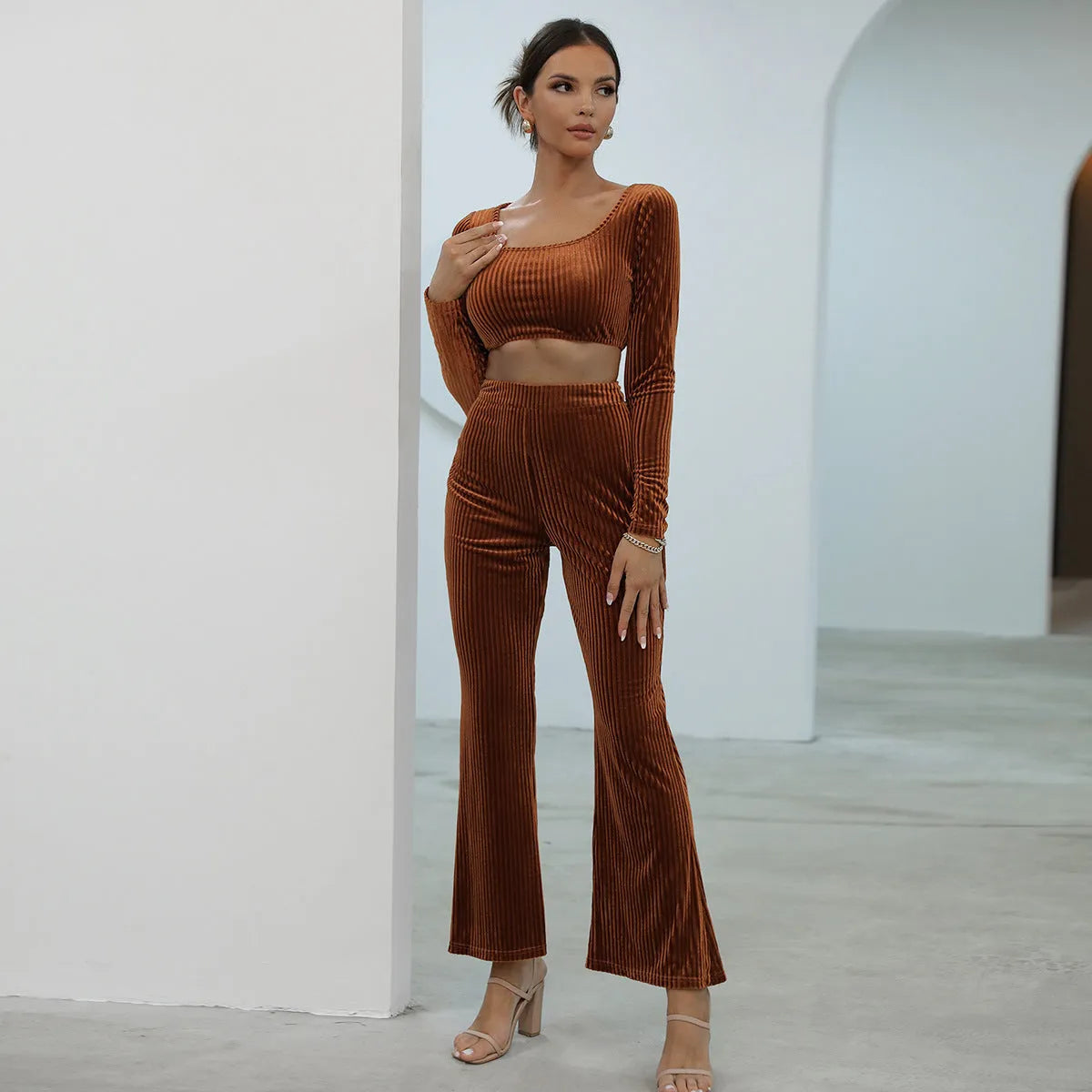 Caramel coloured long sleeve top and matching trousers laid flat, a casual two-piece sweater set.