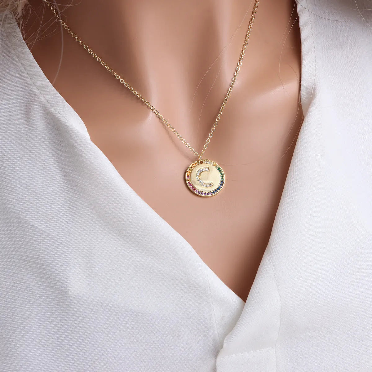 Gold English letter round pendant necklace with colourful crystals on clavicle length chain