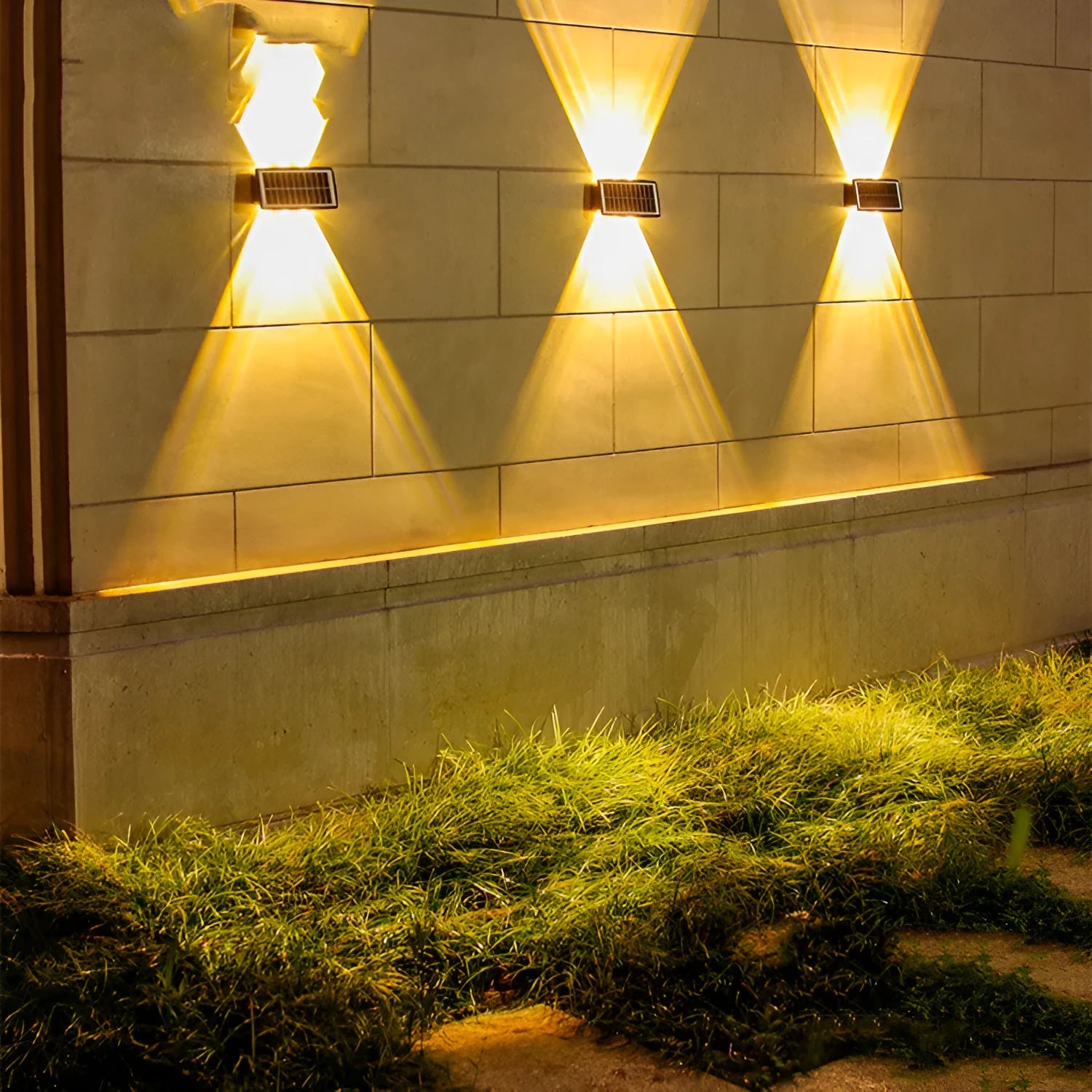 Solar outdoor wall light with 4 LED beads and glass polysilicon panel mounted on a garden wall