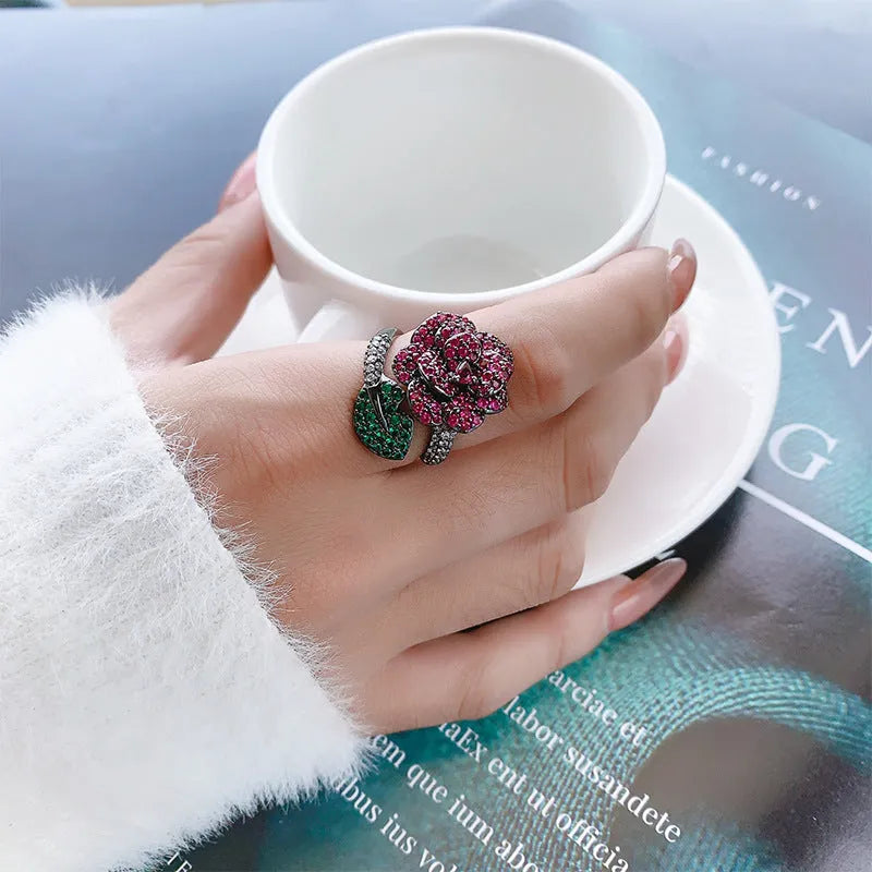 Geometric black gold ring with simulated red corundum stones on gold-plated copper band