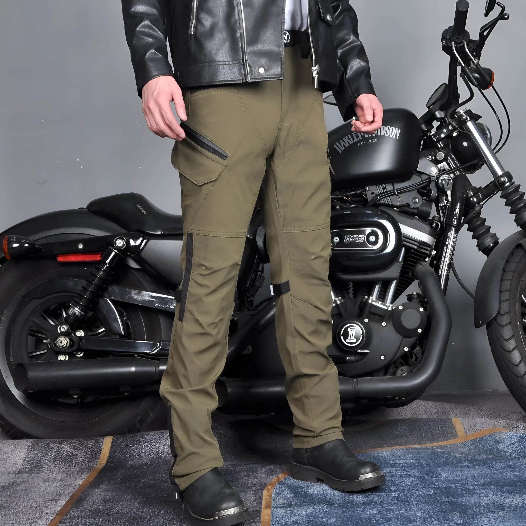 Men's black and green waterproof motorcycle cycling trousers with belt and protective gear.
