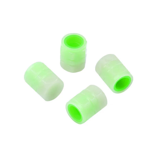 Glow-in-the-dark rubber car tyre valve caps in a set, showing size and luminous feature.