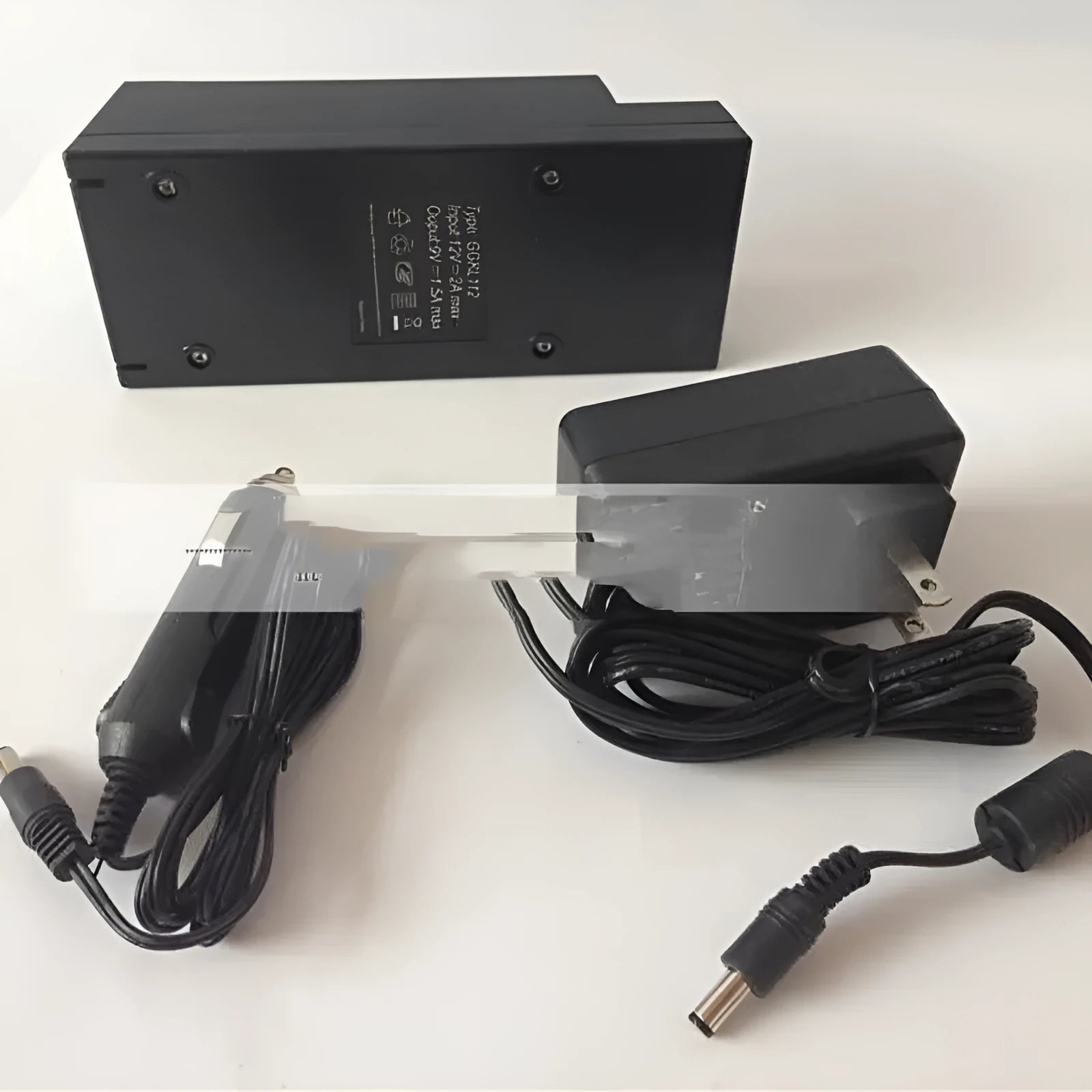 GKL112 220V car charger unit and full installation component kit with UK plug on white background