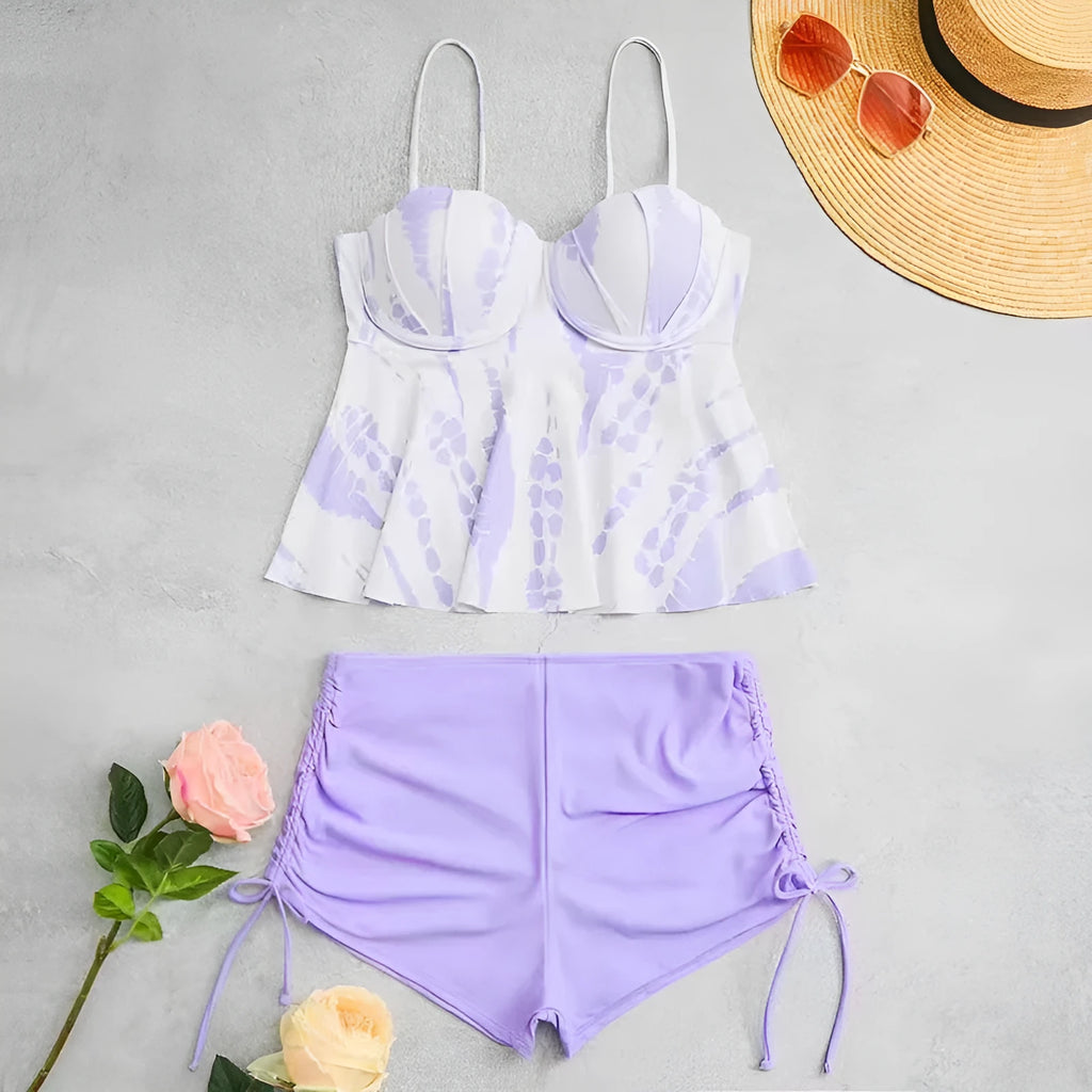 Women's white, blue, and purple polyester bikini swimsuit with matching top and shorts.