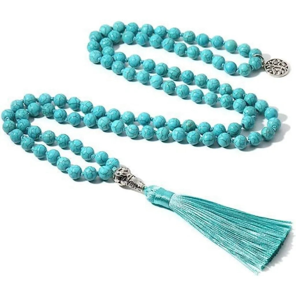 Long handmade necklace with 108 small round stone beads on a black cord, shown doubled up.