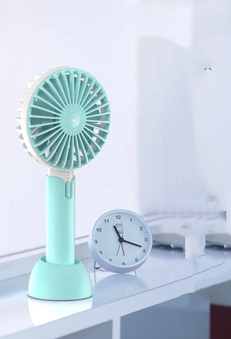 Blue handheld mini USB electric fan with three-speed settings and shaking head motion