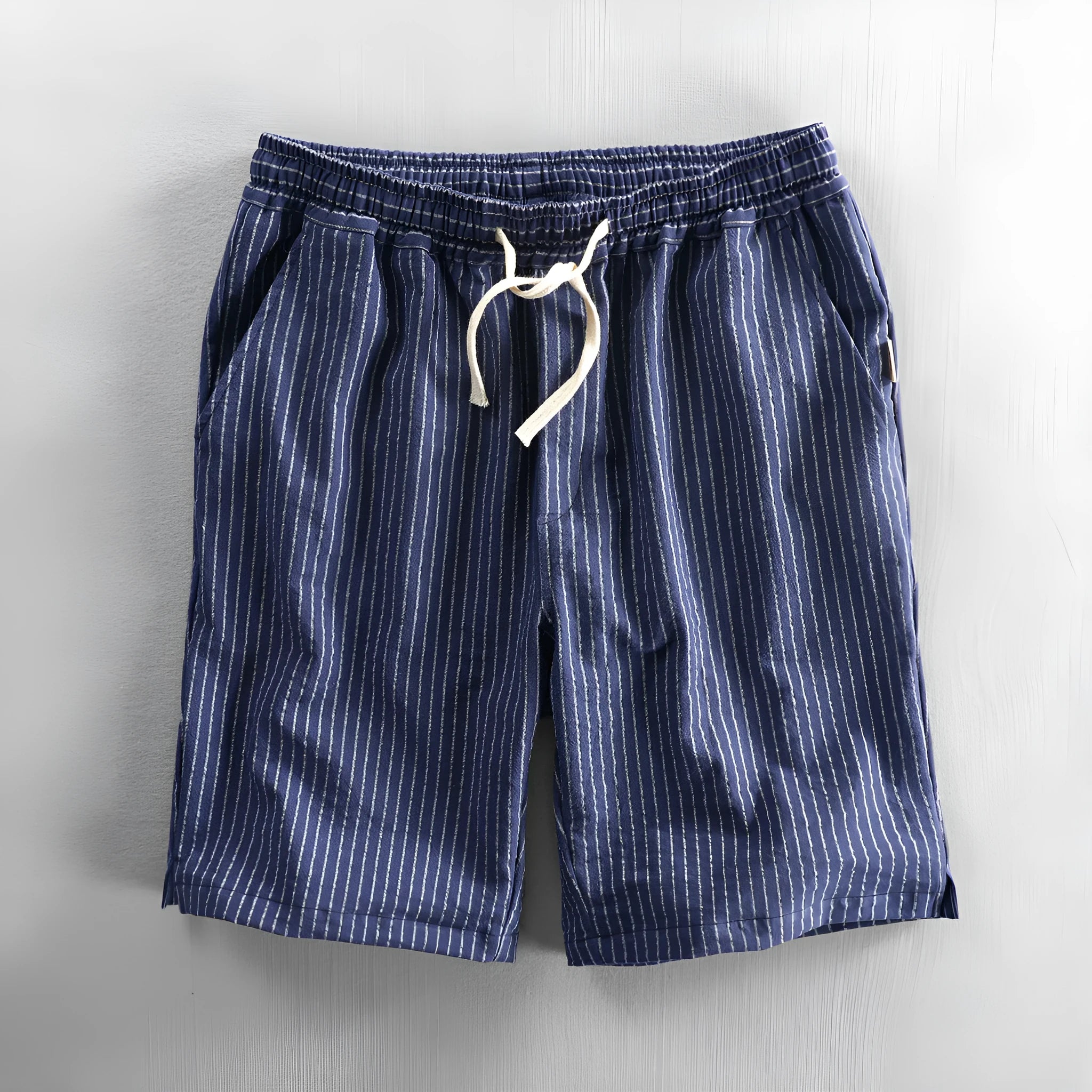 Men's striped casual shorts with elastic waistband in turmeric colour showing loose straight cut