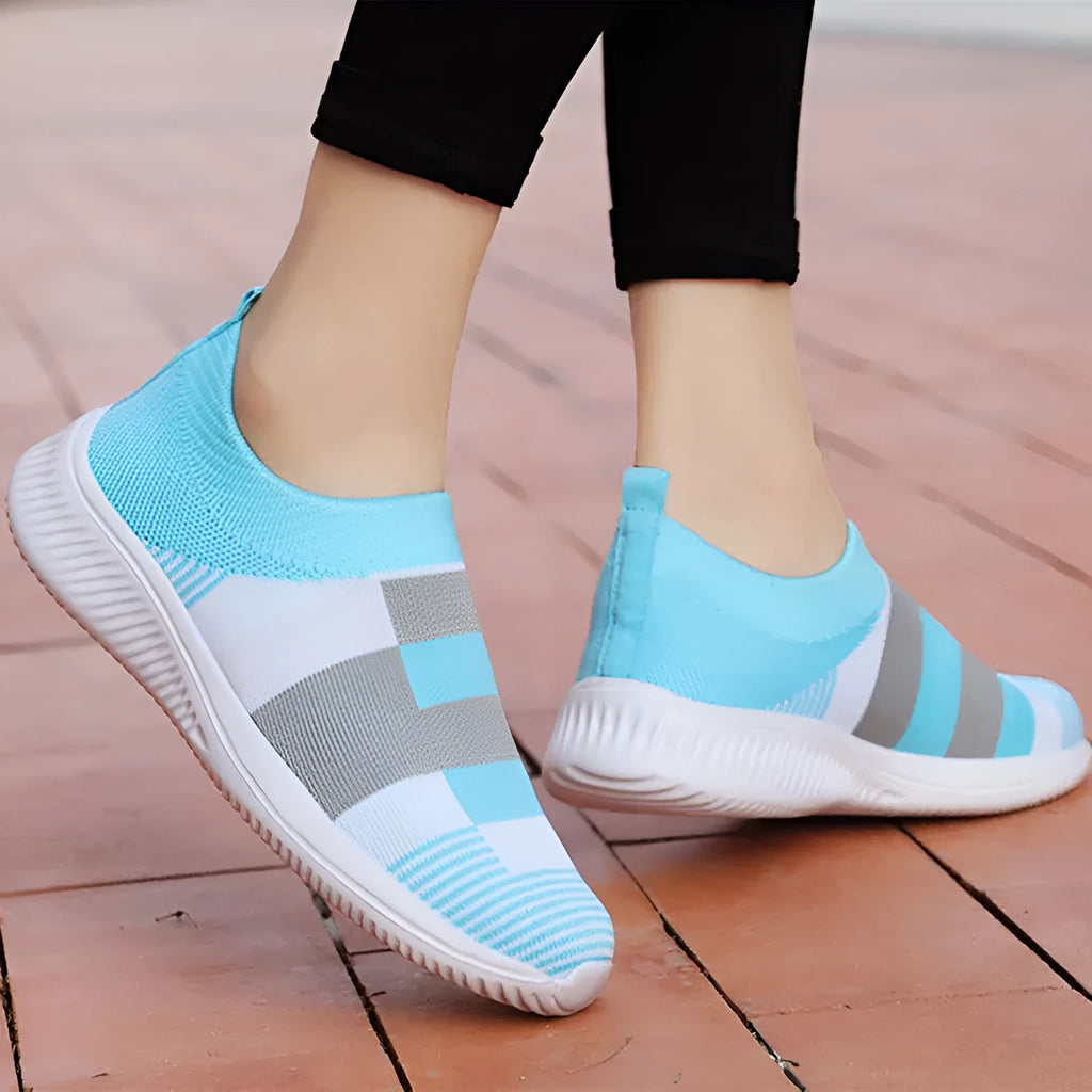 Women's knitted slip-on sneakers in grey with breathable mesh upper and flat foam sole