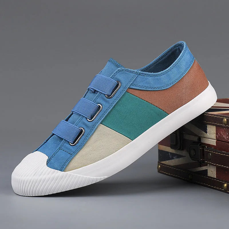 Men's low-top canvas sneakers in beige with colour stitching and an elastic band closure.