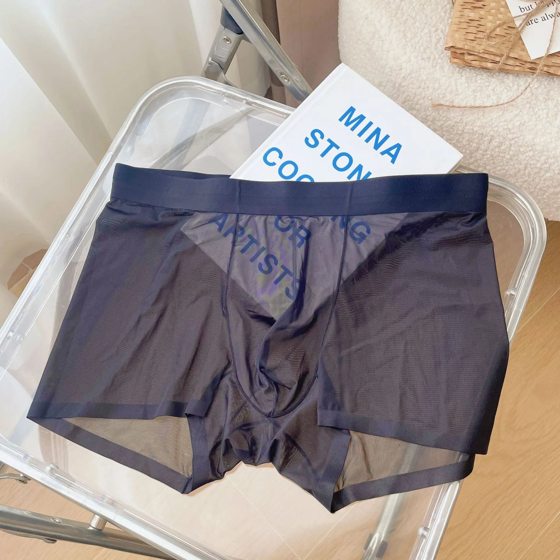Men's thin seamless boxer shorts in quick-dry nylon fabric showing breathable construction and body shaping design