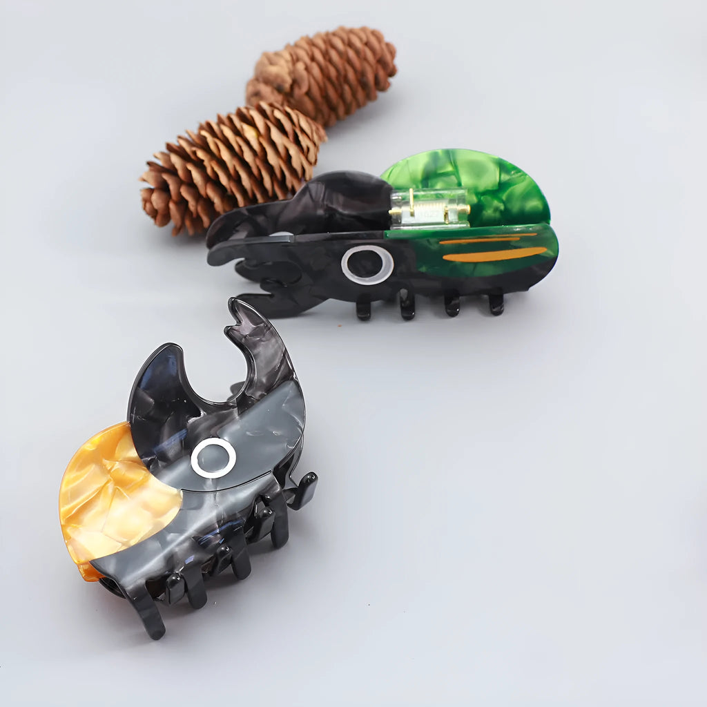 Handmade cellulose acetate beetle hair grip with cartoon caterpillar design in green, orange, or white colour options