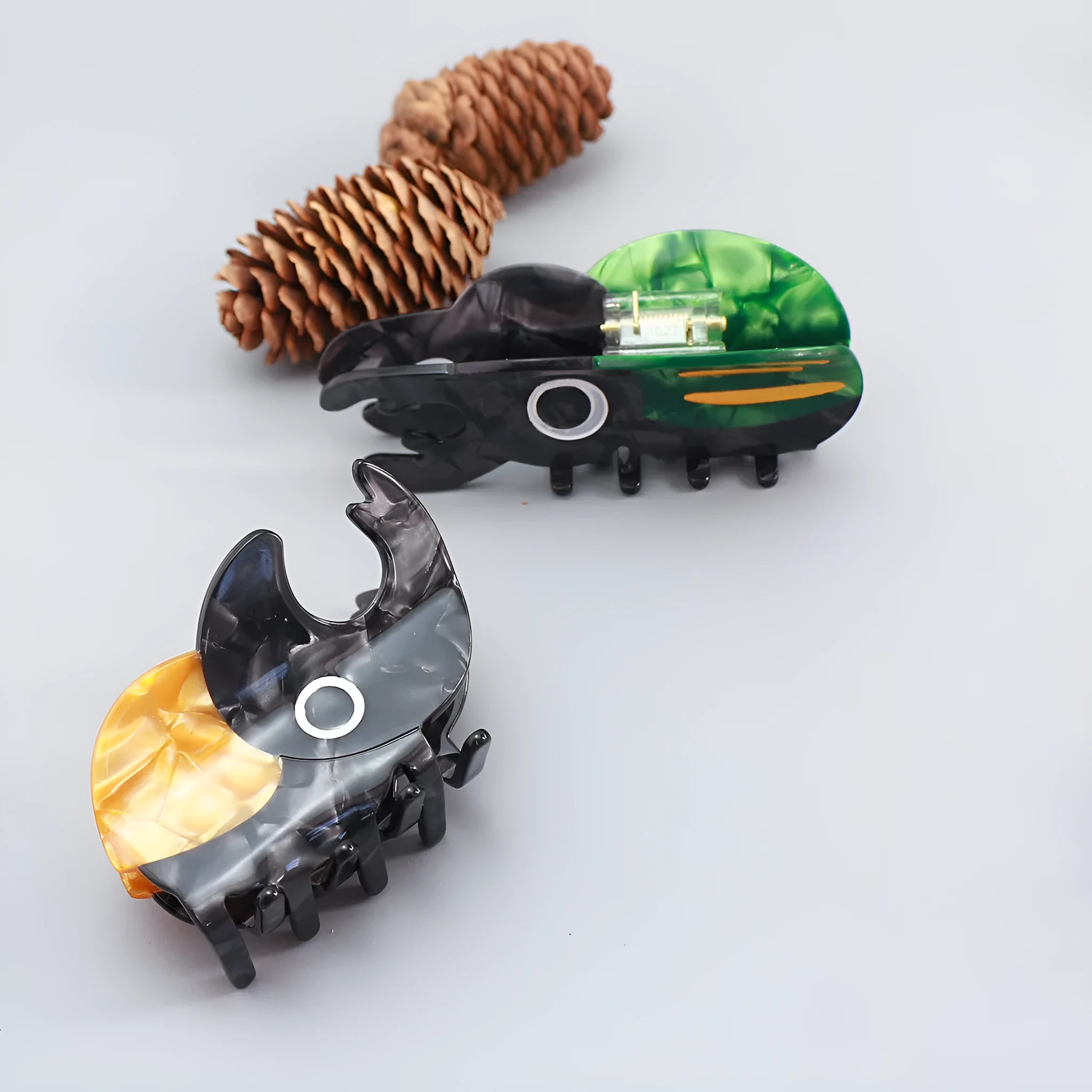 Handmade cellulose acetate beetle hair grip with cartoon caterpillar design in green, orange, or white colour options