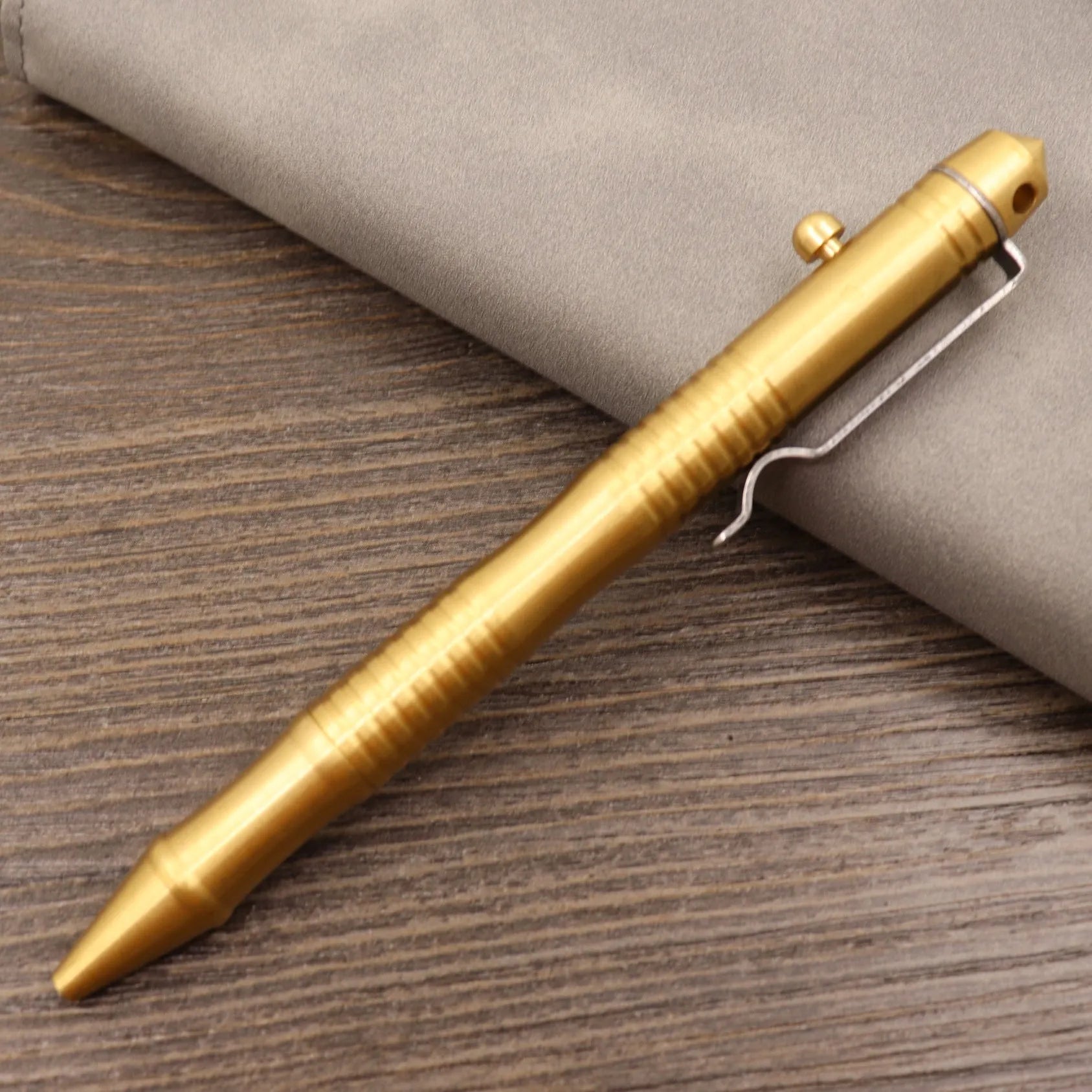 Brass tactical pen with retro colour finish and press mechanism