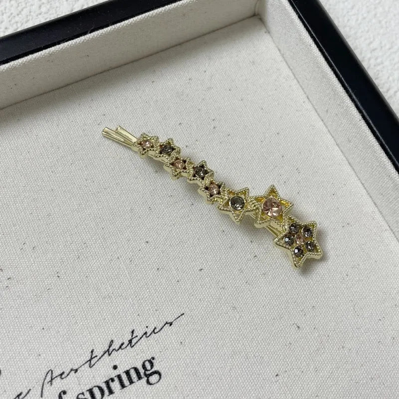 Gold Korean style rhinestone barrette with five-pointed star decoration and side clip for bangs