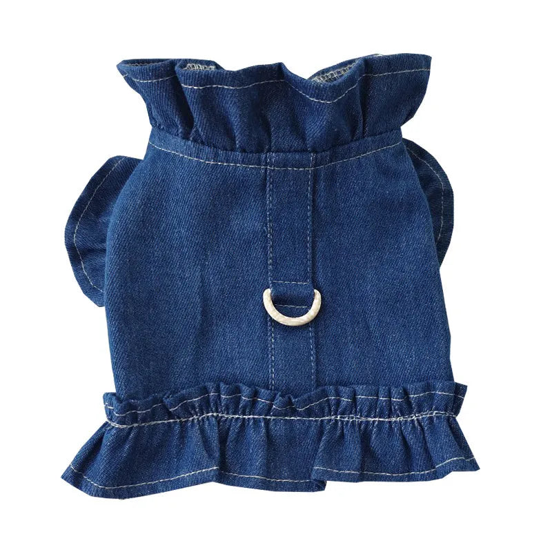 Dark blue denim dog dress with ruffles and a metal leash hook on the chest.