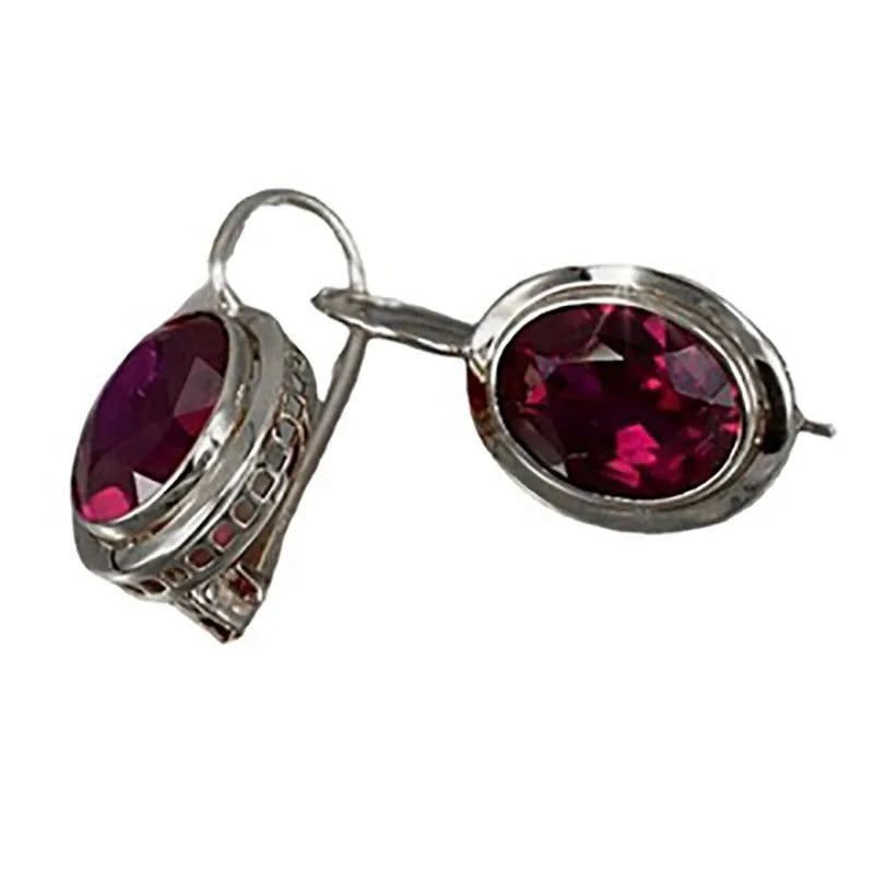 Minimalist hollow oval gemstone earrings in silver colour with geometric design and alloy construction