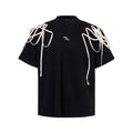 Black loose fit women's T-shirt with padded shoulders featuring rivet ribbon detail
