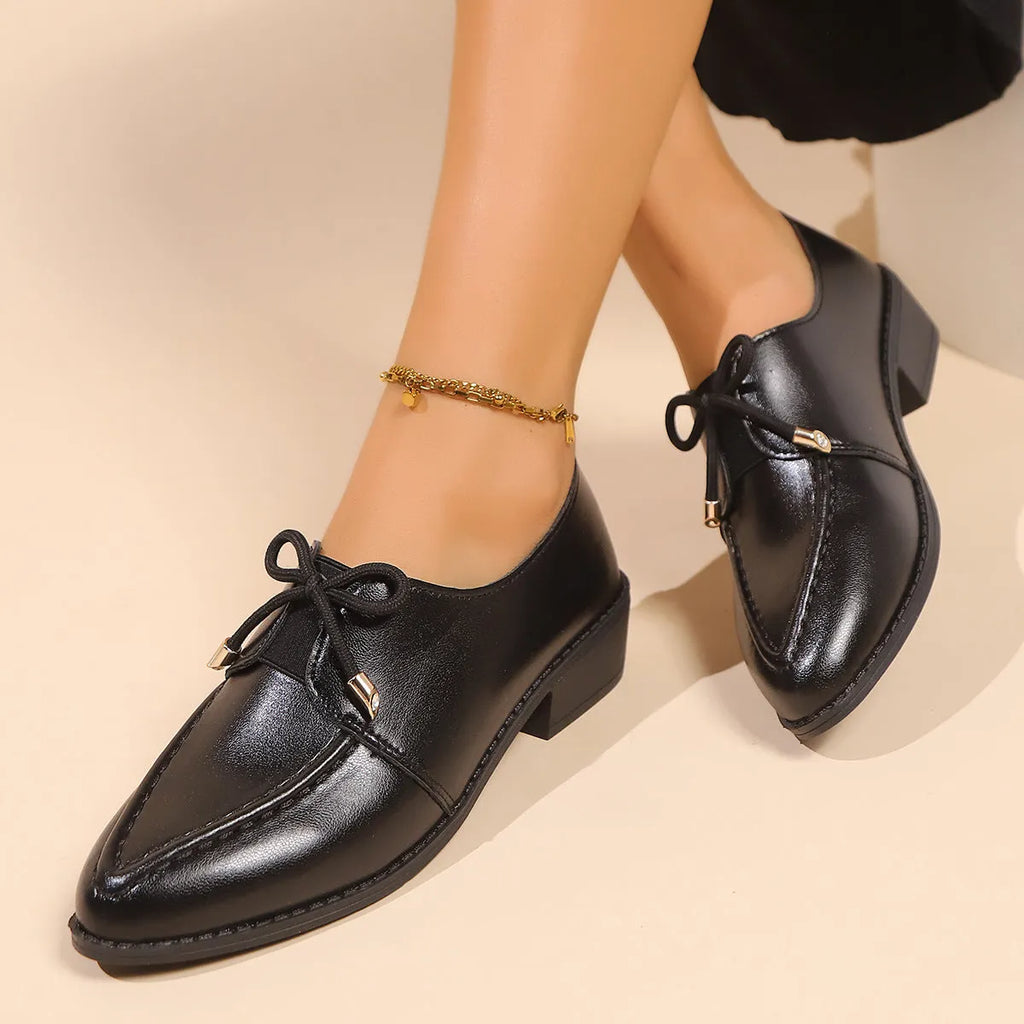 Women's simple leather shoes with a choice of large buckle bow or small bowknot decoration, pointed toe, and rubber sole.