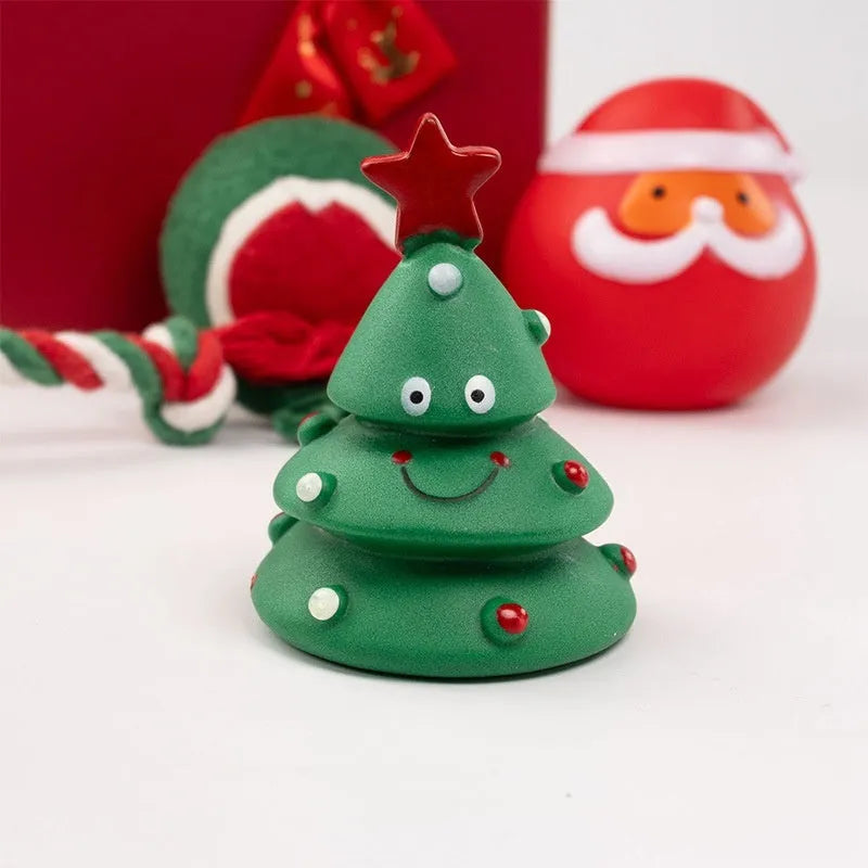 Seven Christmas vinyl dog toy gift sets with bite-resistant designs including Santa heads and holiday shapes