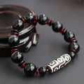 Hand-woven black agate Dzi bead bracelet with 11mm geometric chalcedony beads
