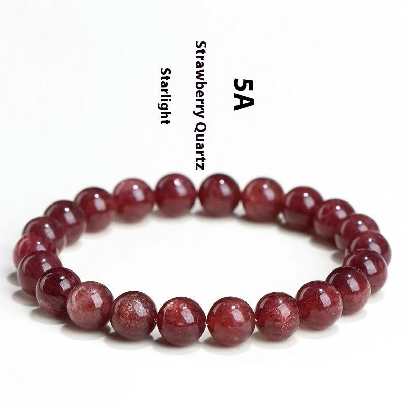 Natural cherry red strawberry quartz bracelet with geometry-shaped beads on a wrist.