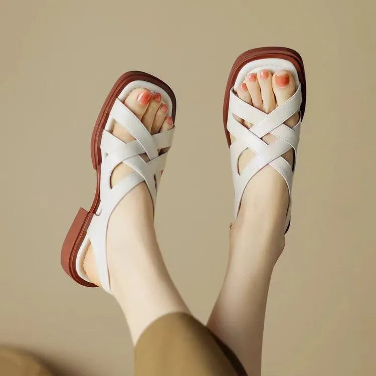 Women's patent leather sandals with square toe and low heel in black, brown and off-white colours